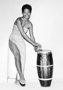 Dr. Maya Angelou playing the bongo